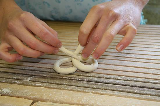 pretzel being twisted by hand