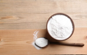 bowl of baking soda on wooden table