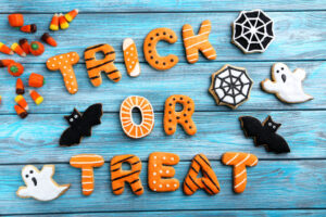 Fresh halloween gingerbread cookies on blue wooden table