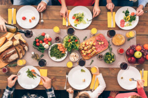 people eating thanksgiving appetizers at dinner table