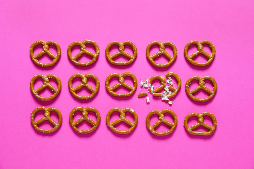 pretzels in a row, one of the pretzels is crushed