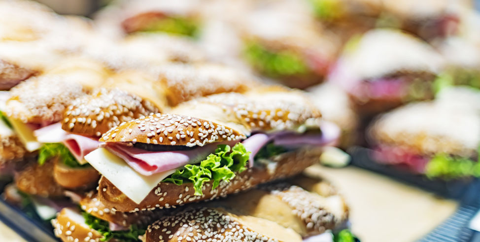 Freshly prepared sandwiches sold in a fast food restaurant.