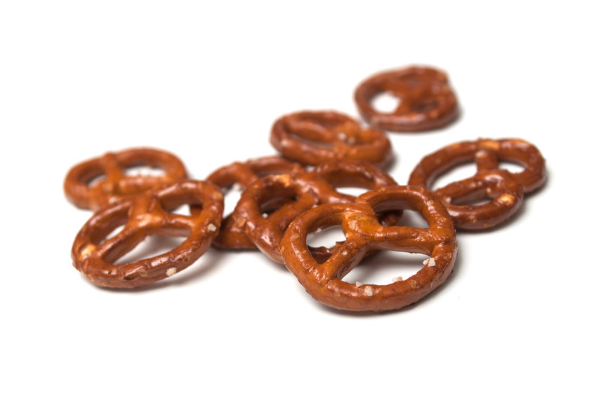 Closeup of salted pretzels on white background